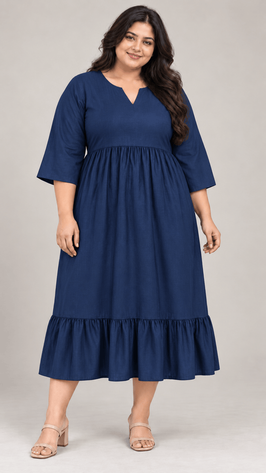 Woman wearing a Bani navy blue cotton viscose curve midi dress by Zinniars Curve