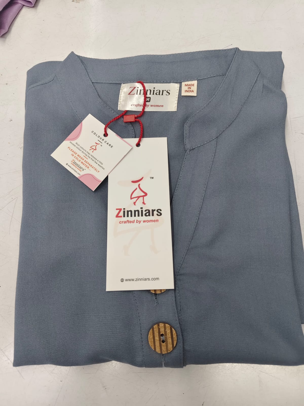 Samairaa Blush Grey Zinniars roll-up kurta with wooden button detail.